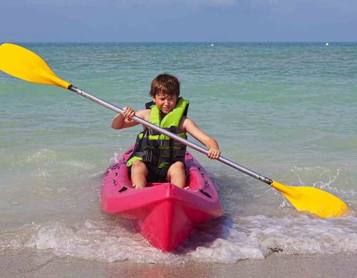 little boy in a kayak